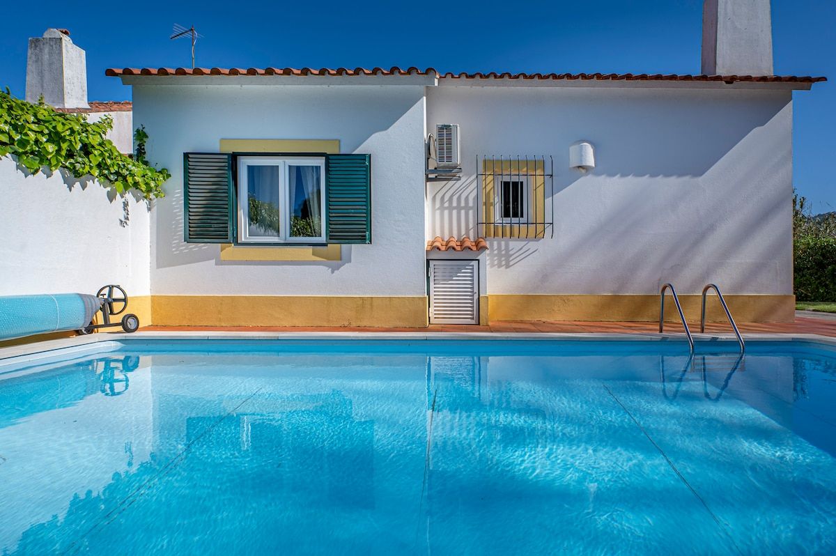 A sparkling, refreshing pool that catches the sunlight beautifully.