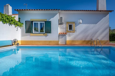 A sparkling, refreshing pool that catches the sunlight beautifully.