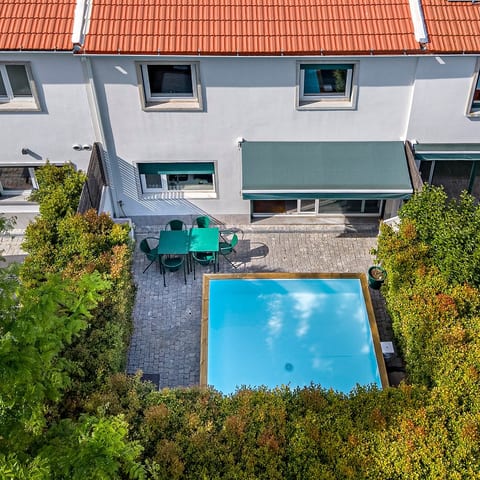Outdoor Oasis: Dive into relaxation by the glistening pool and enjoy al fresco dining under the sun!