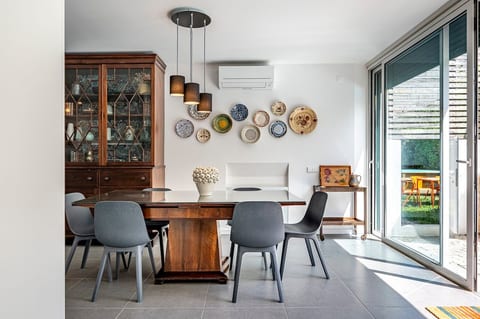 Dining Room: Bright and inviting space with stylish decor and a view to the lovely garden!