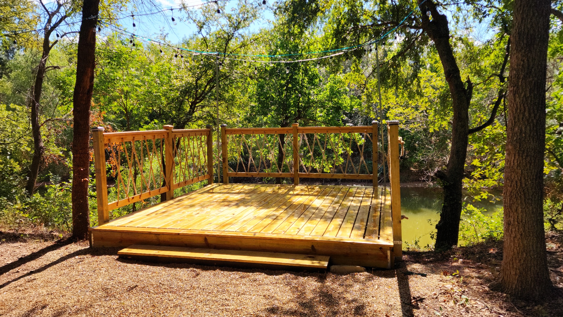 New Sun Deck! Enjoy sunbathing by day and cozy evenings under twinkling string lights—the perfect 12x12' spot on the river.