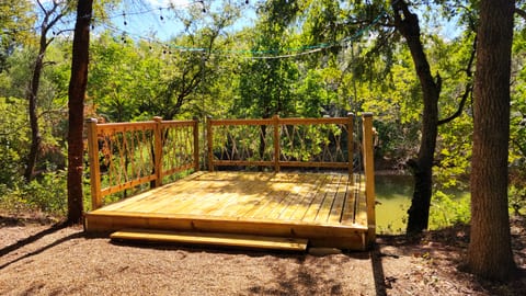 New Sun Deck! Enjoy sunbathing by day and cozy evenings under twinkling string lights—the perfect 12x12' spot on the river.