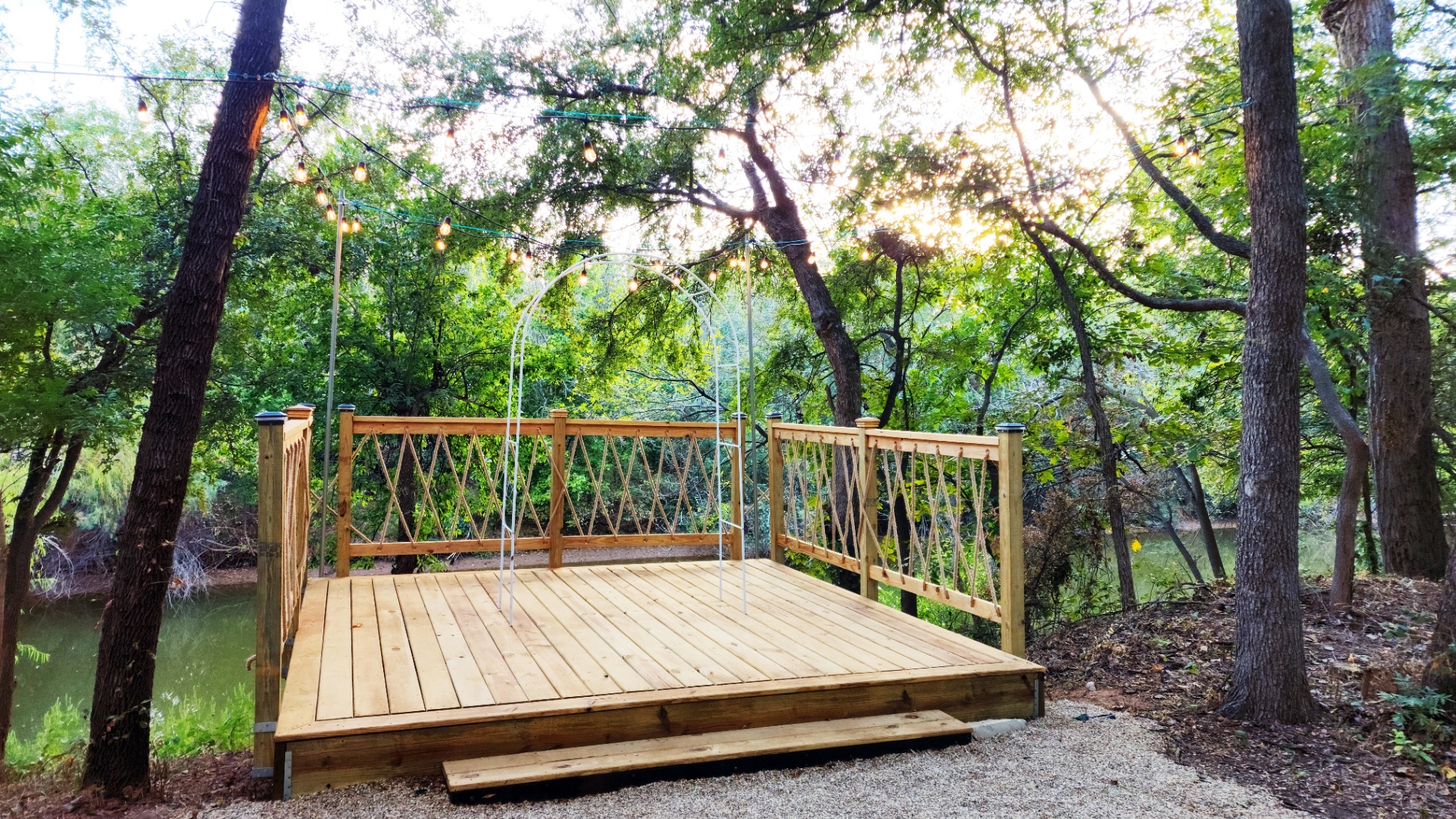 New 12x12' Sun Deck: Lit by warm string lights, it transforms into a magical evening spot for relaxation or an intimate waterside ceremony.