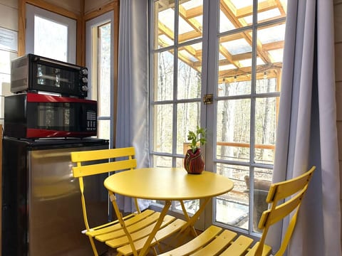 We've added a small bistro set to give guests a place to enjoy a meal. On nice days you can also sit outside!