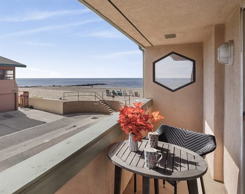 Coffee on the balcony with the ocean breeze coming off the sand...