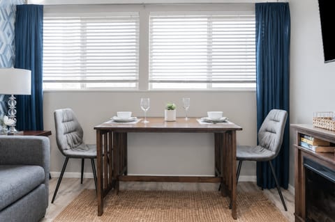The dining area flows seamlessly into the living space, creating a bright, open feel.