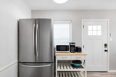 Kitchen with gas range, Full-size refrigerator and plenty of essentials