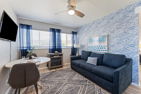 Living Room with Smart TV, Dining Table, Sofa Sleeper