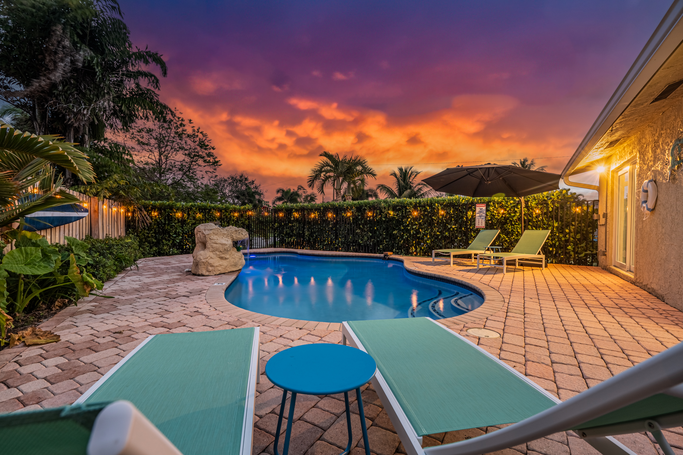 Private pool with loungers and waterfall feature