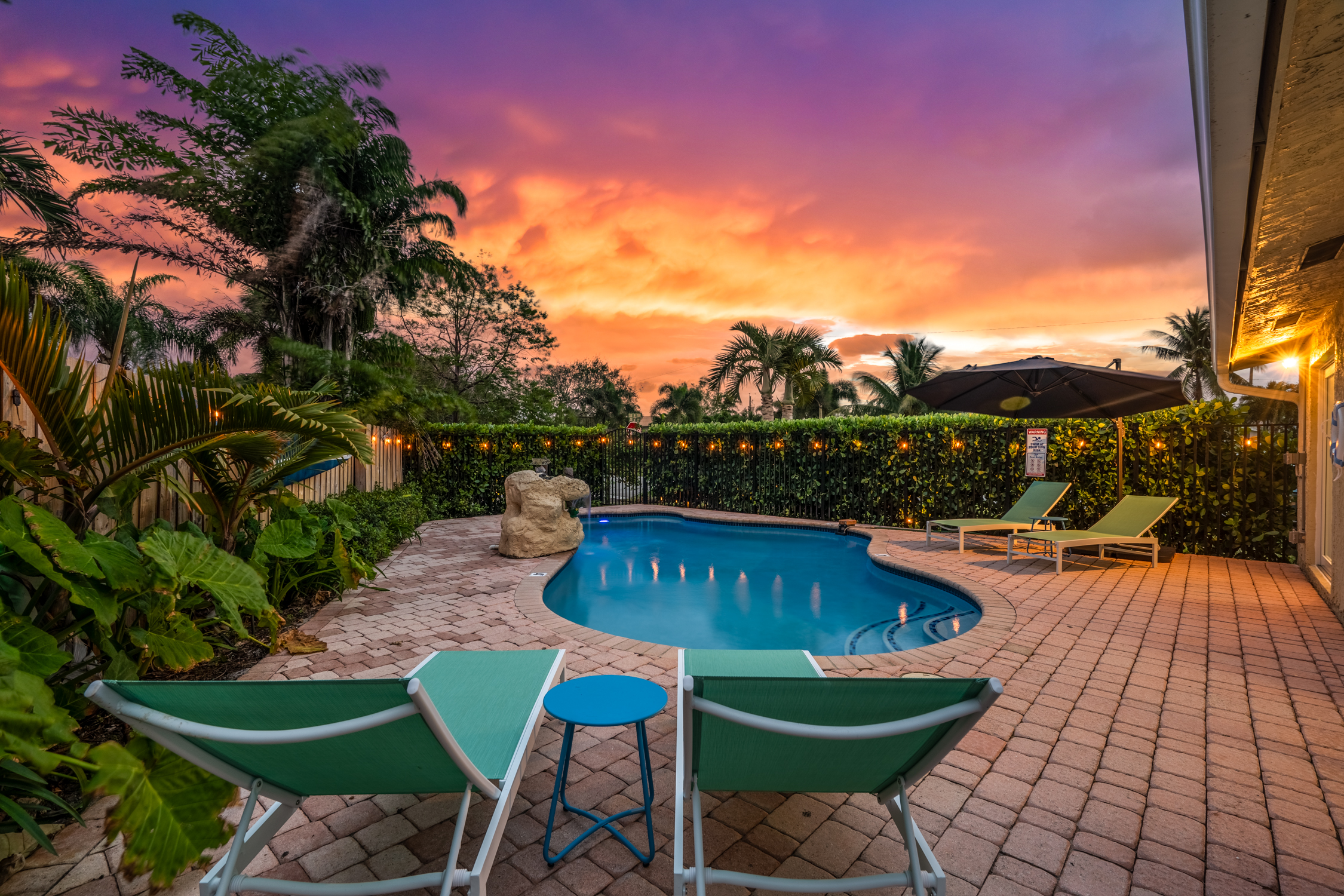 Private pool with loungers and waterfall feature