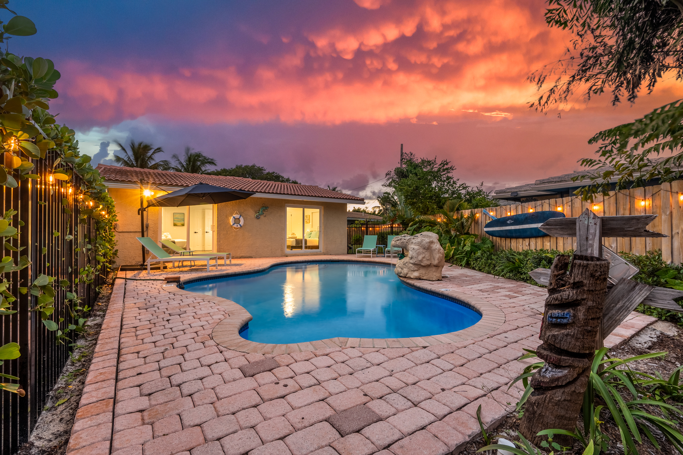 Private pool with loungers and waterfall feature