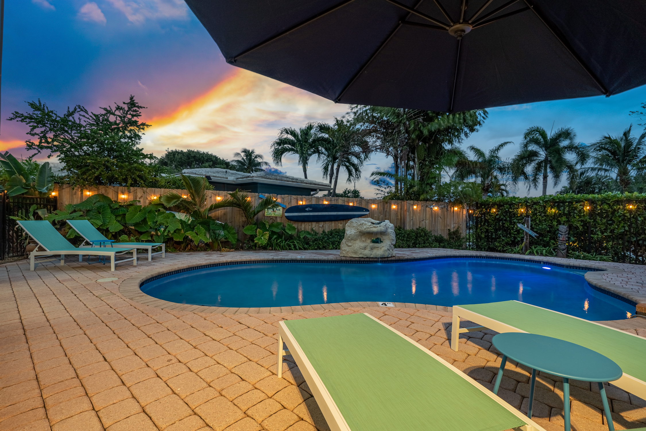 Private pool with loungers and waterfall feature