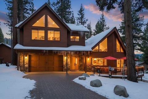 Your winter wonderland awaits with a picturesque cabin surrounded by snow-clad pines. Driveway snowplow service ensures easy access to the driveway and entryway during snowy months. Make this a Tahoe winter for you and your family.