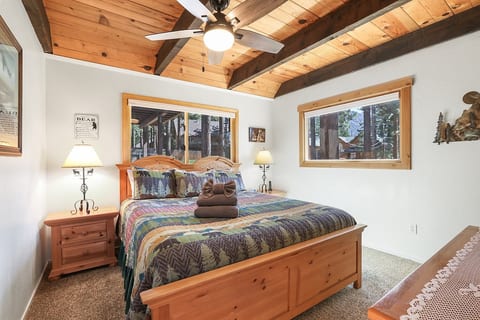Slumber in Style in BR #1: Rest easy in the king-sized bed, where comfort and craftsmanship meet beneath a canopy of wooden beams. Imagine waking up to this view every morning!
Conveniently located on 1st floor with close proximity to the bathroom.