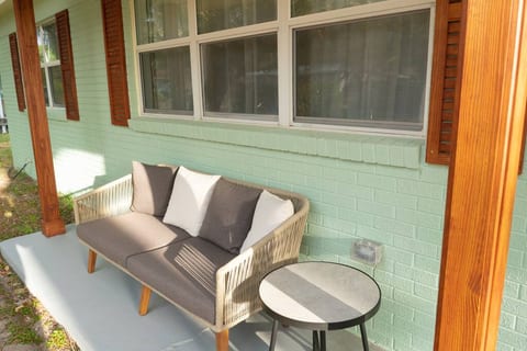 Cozy sitting space on the front porch. There are extra stools in the garage that may be used outdoors as well.