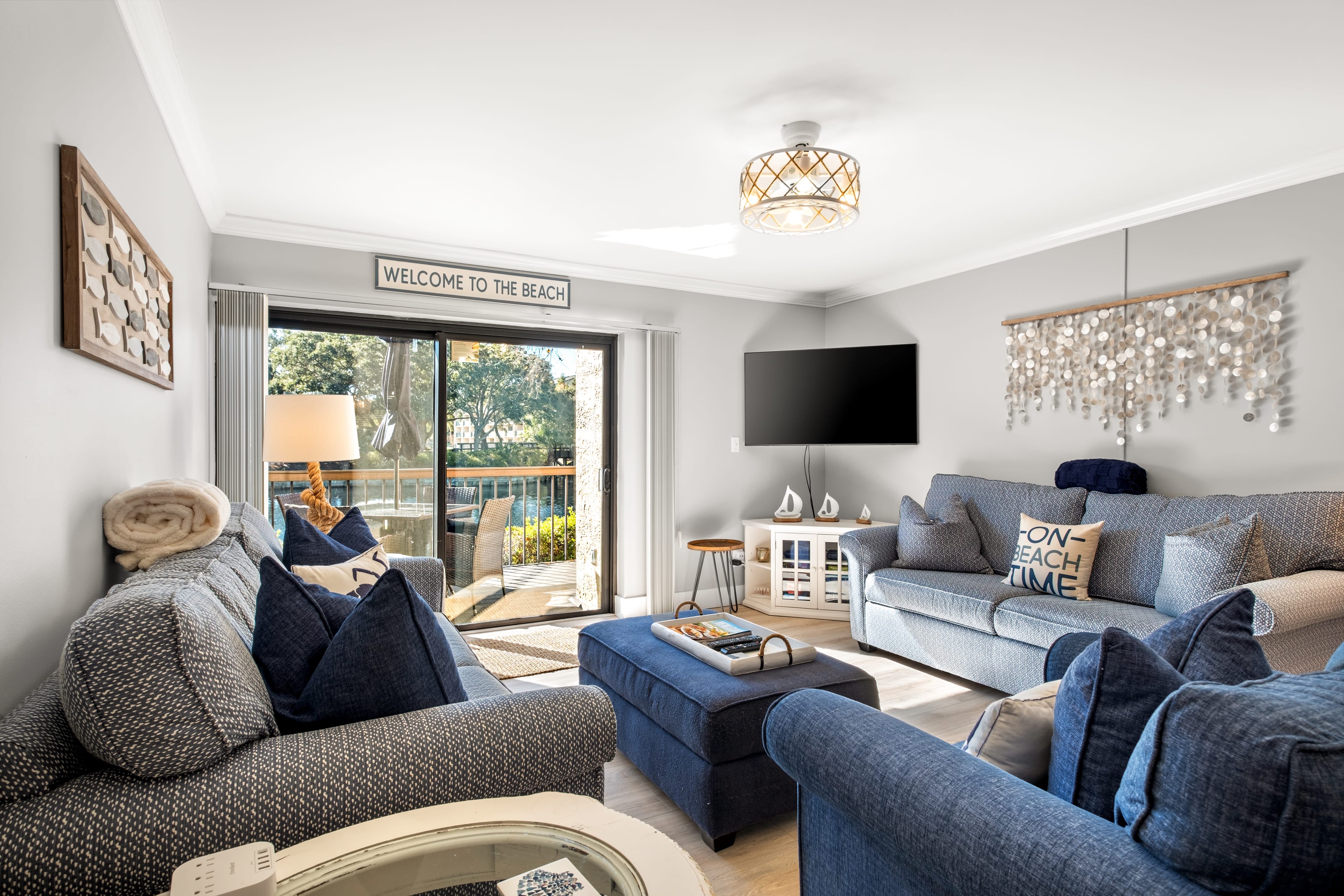 Large comfortable living area with sliders to private deck