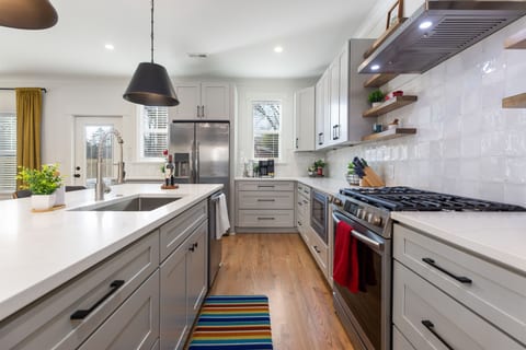 The fully-stocked kitchen has everything you need to cook from home. Stainless steel appliances, quartz countertops, and plenty of extras to make you feel right at home!