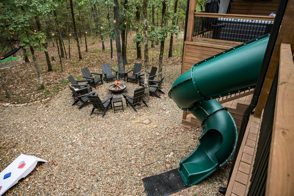 Warm fire pit under string lights—perfect for relaxing nights in the woods!