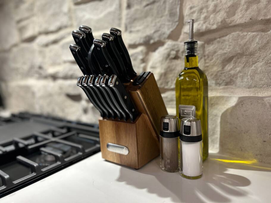 Organized kitchen setup with essential cooking tools and condiments.