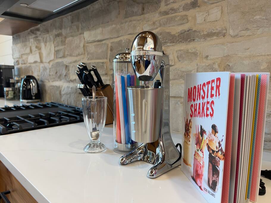 Stylish counter with milkshake maker and vibrant kitchen decor.

