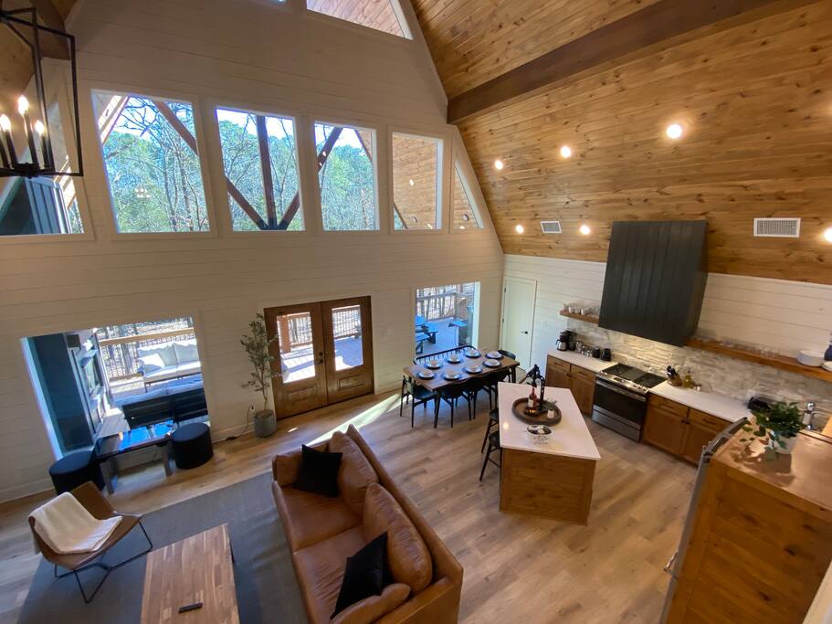 Stunning A-frame cabin with high ceilings, cozy fireplace, and scenic views.