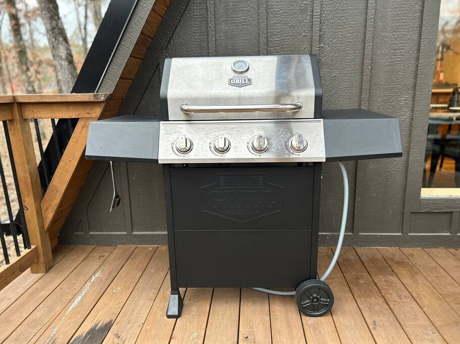 Fire up the grill for a perfect outdoor BBQ on this cozy deck with nature views!
