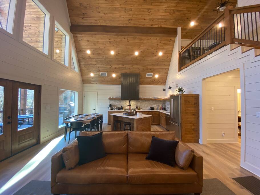 Rustic cabin kitchen with natural light and cozy wooden decor.