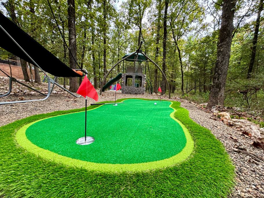 Inviting cabin retreat with outdoor games and scenic forest views at dusk.