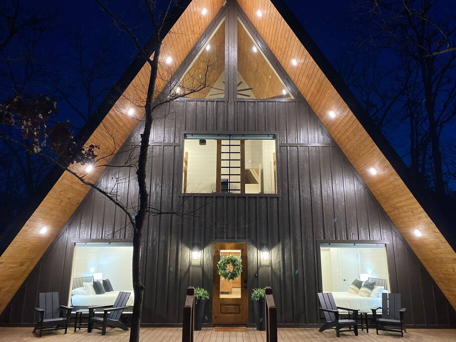 Stunning Yay-frame cabin with modern lighting and cozy interior in Broken Bow, Oklahoma.