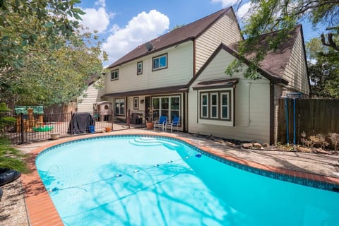 Swimming pool, grill, and backyard