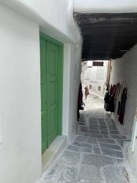 View of entrance and shops nearby.