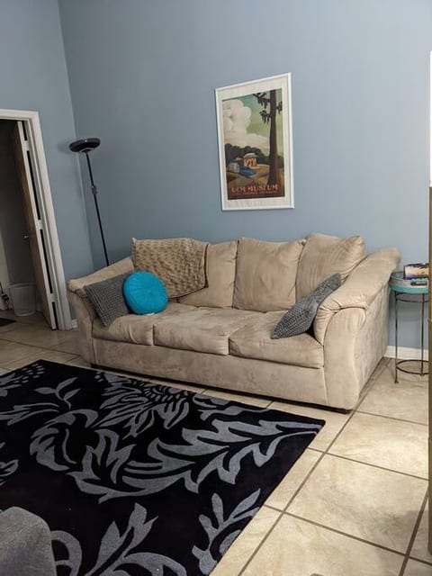 Front room with pull out sofa, 2 chairs and Roku TV