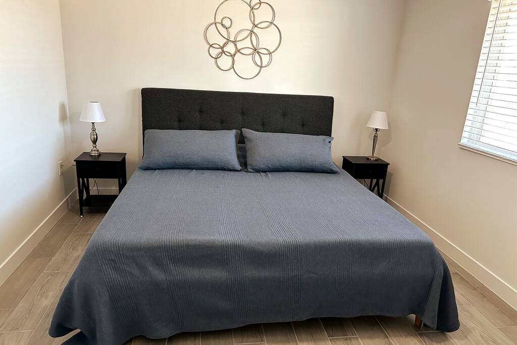 2nd Bedroom with king sized bed.  Ceiling fan.