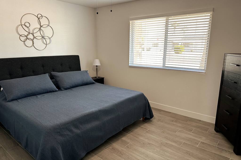 2nd Bedroom with king sized bed.  Ceiling fan.