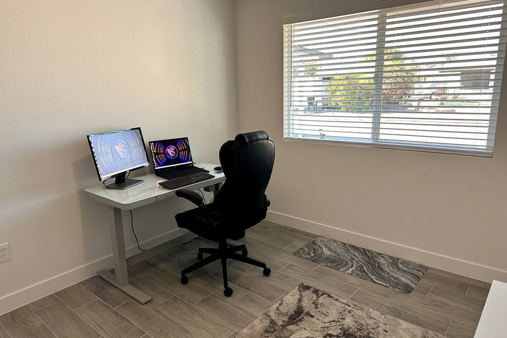 Office with desk in sitting position.