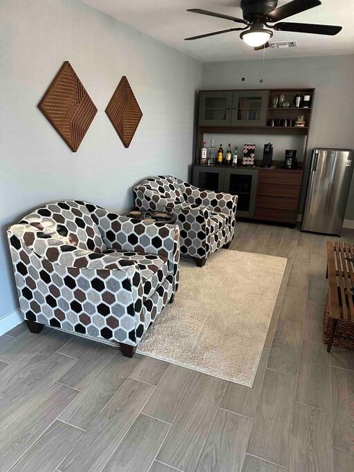 Seating area with mini-fridge and 42" Roku TV.  Bar/pantry wall unit with coffee station.  This room also has a ceiling fan.