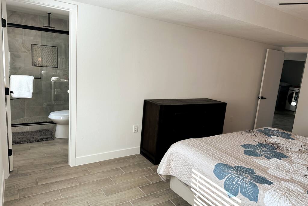 Master bedroom with Sleep Number Split-top King bed.  Ceiling fan.    Looking into master bathroom.