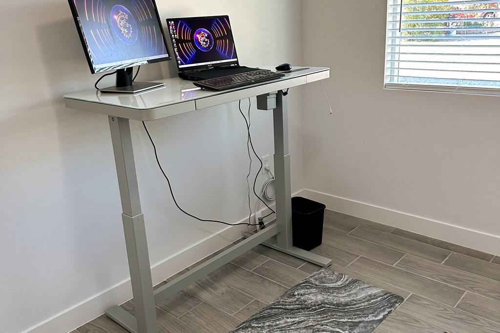 Office with desk in standing position.