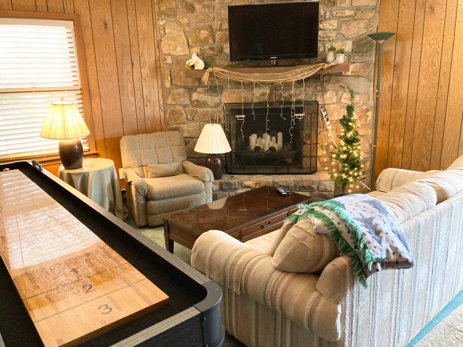 2nd living room has pull out couch, shuffleboard, games, TV. (Update:  walls have been painted a gray color - see next picture) - Base Camp at Hawks Nest - Seven Devils