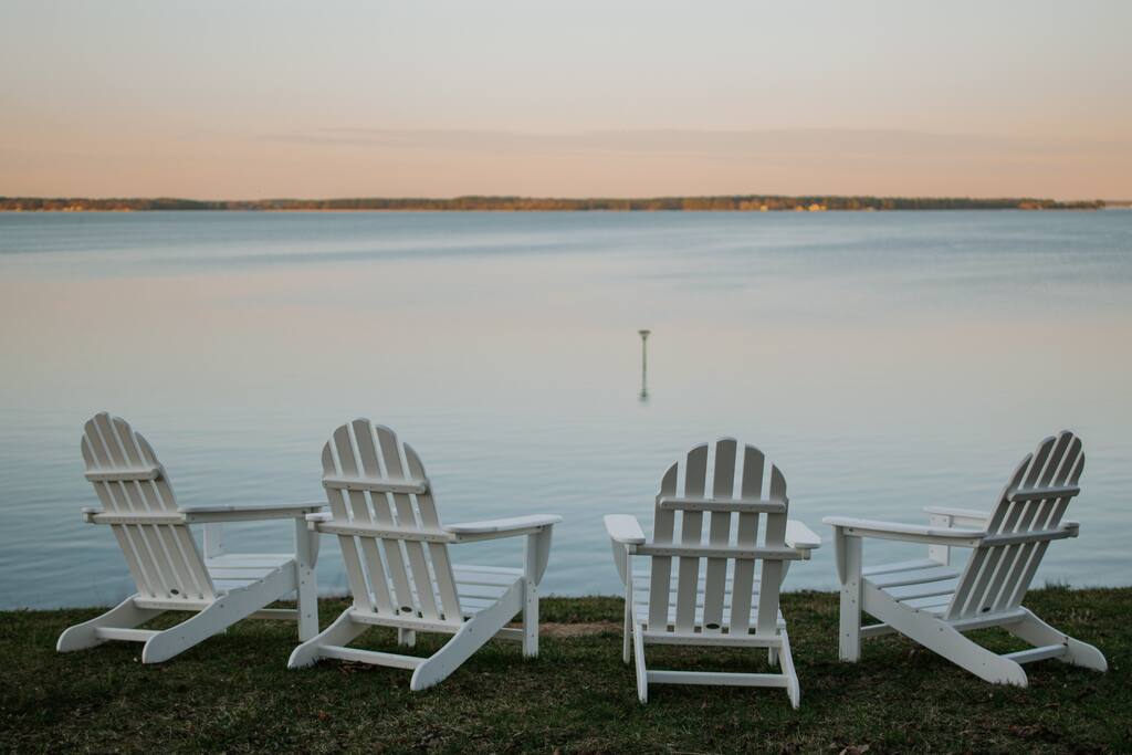 Enjoy a sunset drink overlooking sweeping views of the Rappahannock and listening to the waves break against the riprap. - Cozy Waterfront Getaway Fireplace/Kayaks/Fire Pit - Locust Hill