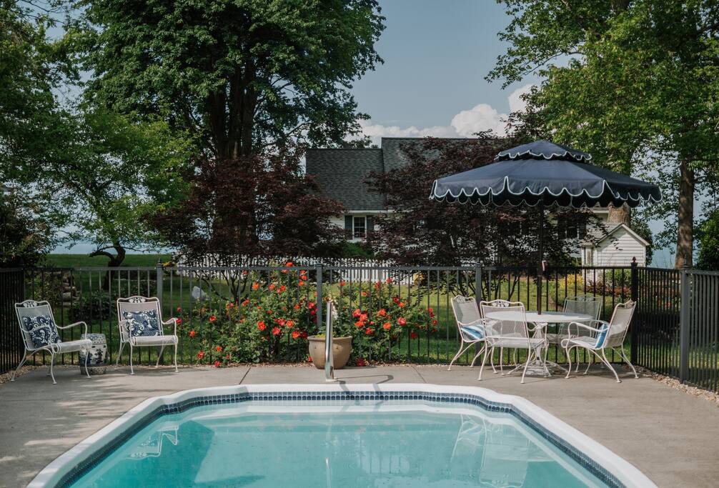 Slip into the saltwater pool from late spring through early fall. - Cozy Waterfront Getaway Fireplace/Kayaks/Fire Pit - Locust Hill