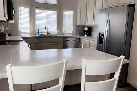 Seating for 2 additional people at the countertop.