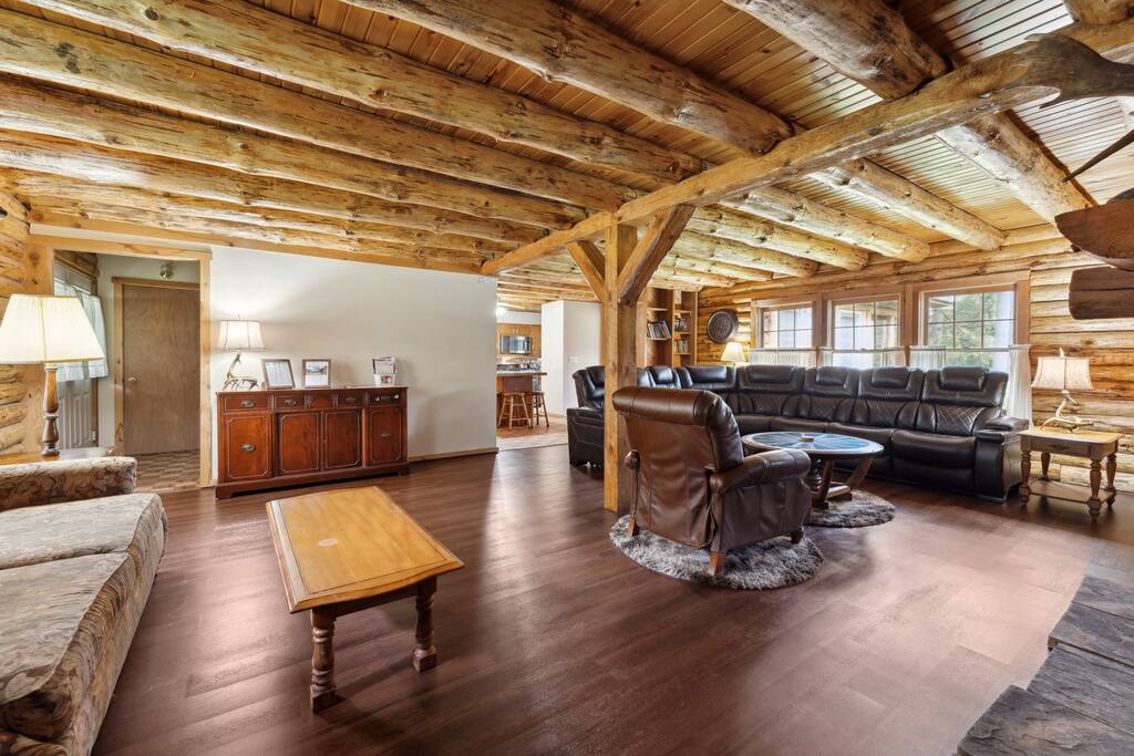 Living room of the lodge includes a leather sectional couch, Roku TV, wood burning fireplace, blu-ray plaer with tons of movies, additional recliner, and great decor. There is also a library with a variety of reading materials and new flooring. Living room of the lodge includes a leather sectional couch, Roku TV, wood burning fireplace, blu-ray plaer with tons of movies, additional recliner, and great decor. There is also a library with a variety of reading materials and new flooring. - Eagle Bluff Estate - Mauston