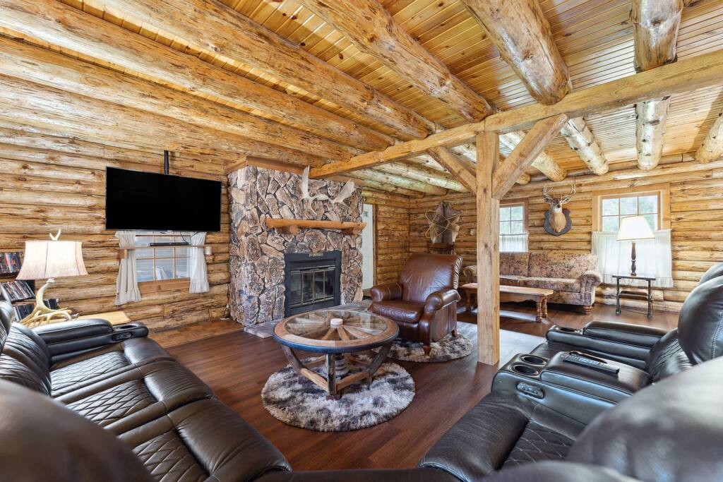 Living room of the lodge includes a leather sectional couch, Roku TV, wood burning fireplace, blu-ray plaer with tons of movies, additional recliner, and great decor. There is also a library with a variety of reading materials and new flooring. Living room of the lodge includes a leather sectional couch, Roku TV, wood burning fireplace, blu-ray plaer with tons of movies, additional recliner, and great decor. There is also a library with a variety of reading materials and new flooring. - Eagle Bluff Estate - Mauston