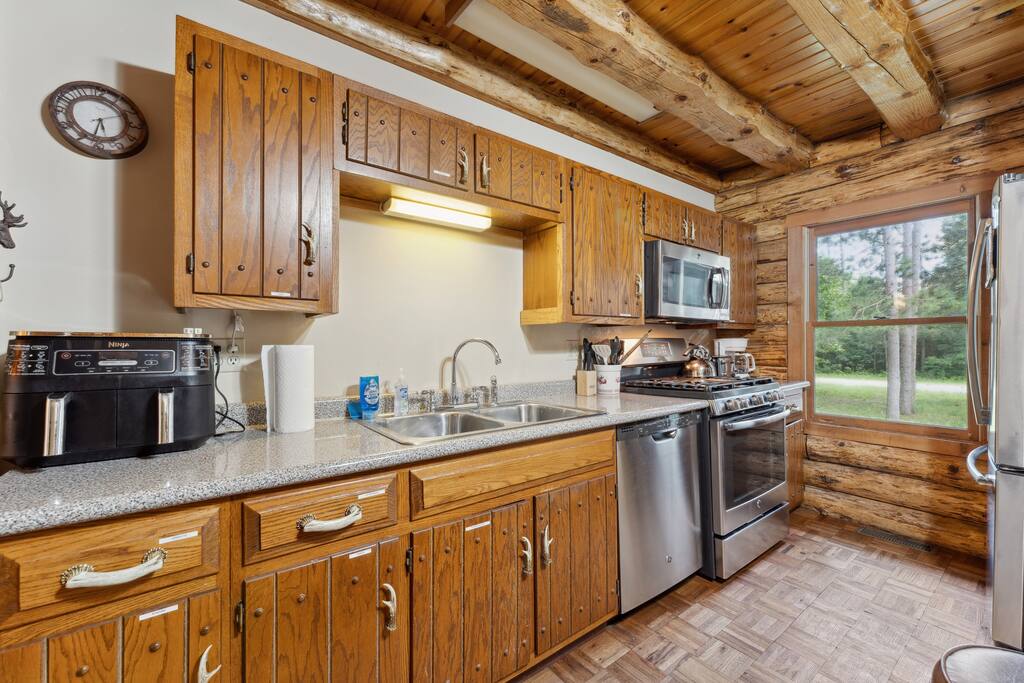 The lodge kitchen has bar stools for the island, air fryer, Keurig, dishwasher, stove, microwave, fridge, pots & pans, dinnerware, blender, tea & tea pot, Keurig (BYO K-Cups) and coffee pot (coffee supplied), small selection of spices and much more. The lodge kitchen has bar stools for the island, air fryer, Keurig, dishwasher, stove, microwave, fridge, pots & pans, dinnerware, blender, tea & tea pot, Keurig (BYO K-Cups) and coffee pot (coffee supplied), small selection of spices and much more. - Eagle Bluff Estate - Mauston