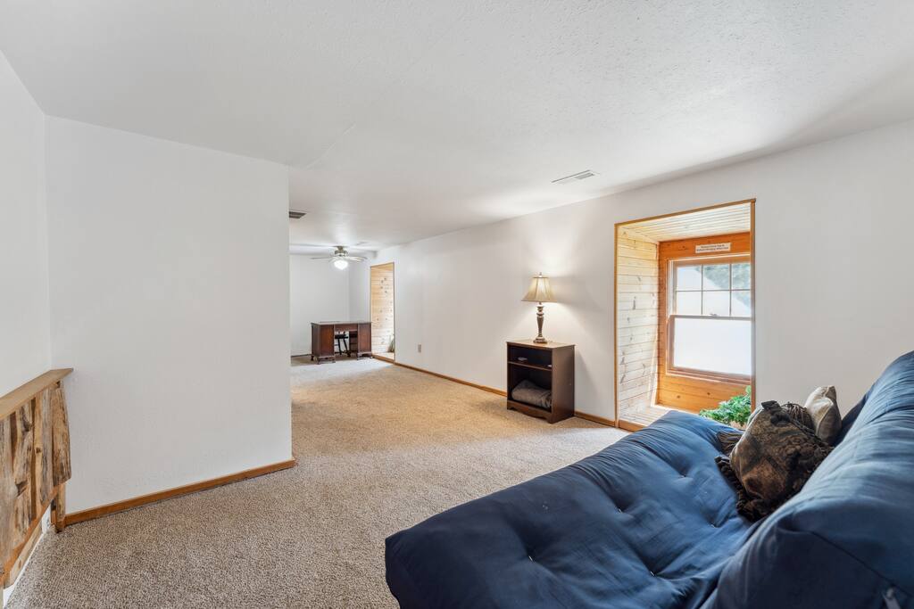 Upstairs lodge loft with queen futon, work desk, and tons of extra space for relaxing. Upstairs lodge loft with queen futon, work desk, and tons of extra space for relaxing. - Eagle Bluff Estate - Mauston