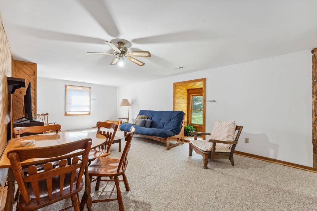 Upstairs lodge loft with queen futon, Roku TV, table & chairs, and extra space for relaxing. Upstairs lodge loft with queen futon, Roku TV, table & chairs, and extra space for relaxing. - Eagle Bluff Estate - Mauston