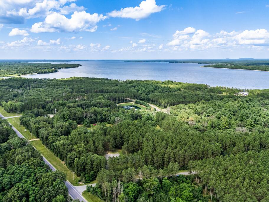 Drone photo with the amazing view of Eagle Bluff Estate. In the background is Castle Rock Lake, where that you can enjoy any water activity including boating, tubing, water skiing, swiming and more. It is a .5 mile walk or 1.7 mile drive to the beach Drone photo with the amazing view of Eagle Bluff Estate. In the background is Castle Rock Lake, where that you can enjoy any water activity including boating, tubing, water skiing, swiming and more. It is a .5 mile walk or 1.7 mile drive to the beach - Eagle Bluff Estate - Mauston