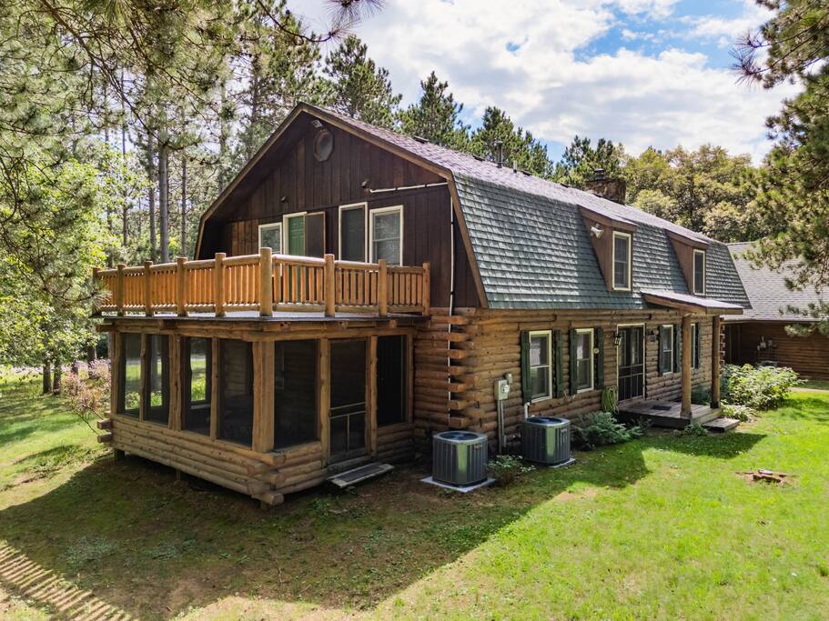 Balcony attached to two of the upstairs lodge bedrooms and the screened-in porch below attaches to one of the bedrooms and has exterior access. This is a great place to unplug, relax, and watch Mother Nature. Balcony attached to two of the upstairs lodge bedrooms and the screened-in porch below attaches to one of the bedrooms and has exterior access. This is a great place to unplug, relax, and watch Mother Nature. - Eagle Bluff Estate - Mauston