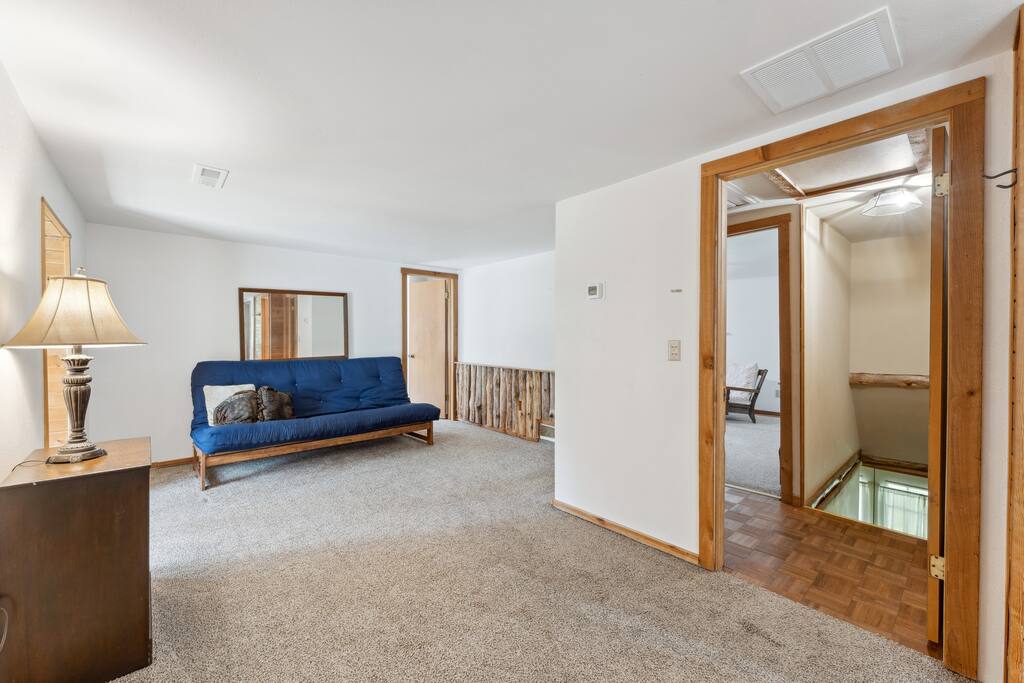 Upstairs lodge loft with queen futon, work desk, and tons of extra space for relaxing. Upstairs lodge loft with queen futon, work desk, and tons of extra space for relaxing. - Eagle Bluff Estate - Mauston